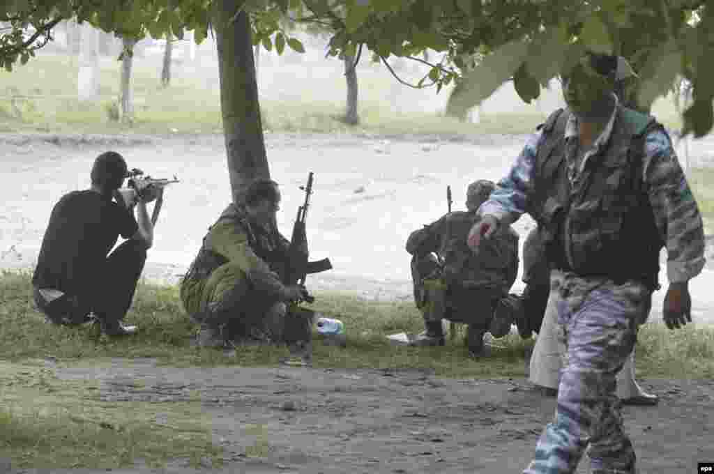 Russian soldiers take up positions in front of School No. 1 in Beslan after militants stormed the building on September 1, 2004.