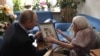 Vladimir Putin meets veteran rights activist Lyudmila Alekseyeva on the occasion of her 90th birthday in Moscow on July 20.