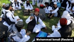 A newly freed Taliban prisoner takes a selfie at Pul-e Charkhi prison in Kabul on May 26.