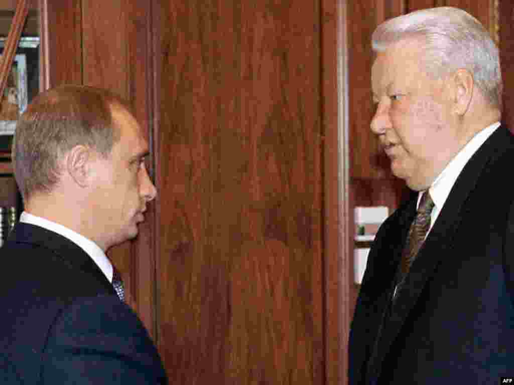 Yeltsin (right) meets with Prime Minister Putin in the Kremlin on September 16, 1999, a month after he was named to head the government.