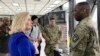 Secretary of the U.S. Army Christine Wormuth (left) speaks with a solider at an army recruiting display. (file photo)