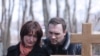 The parents of Maksim Mareyev, who was killed by one of the bombings in Moscow's subway on March 29, mourn at his funeral on March 31.