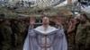 Military chaplain Yuriy of the 24th Mechanized Brigade holds a church service for an infantry unit during Christmas near the frontline town of Chasiv Yar, Donetsk region, Ukraine.