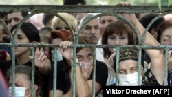 People look for their relatives among dead bodies following the bloody Beslan hostage siege in Russia's North Ossetia region in 2004.