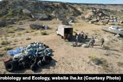 Scientists collect garbage and abandoned fishing nets on the Caspian shore in 2023.