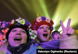 Pro-European protesters take part in New Year's celebrations on Independence Square in central Kyiv on January 1, 2014.