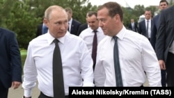 Russian President Vladimir Putin (left) and Prime Minister Dmitry Medvedev visit the Black Sea town of Anapa in August.