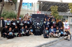 Iranian students hold pictures of the victims during a memorial for the passengers of the Ukrainian airliner at the University of Tehran on January 14.