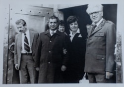 Karmal (second left) with Cenek Jelinek (right), the state forest director for the Kraslice region, near Sindelova in 1978-79.