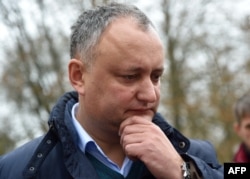 Igor Dodon told reporters that his party has nothing to do with an anonymous leaflet smear campaign. (file photo)