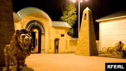 Golden lions guard the entrance gates to Kadyrov's sprawling residence near Gudermes.