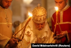 Georgian Patriarch Ilia II leads a midnight Christmas service at the Holy Trinity cathedral in Tbilisi in 2018.