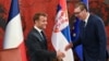 Serbian President Aleksandar Vucic (right) shakes hands with French President Emmanuel Macron in Belgrade on August 29. 