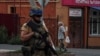 A Ukrainian soldier patrols an area of the Russian town of Sudzha controlled by the Ukrainian Army in the Kursk region on August 16.