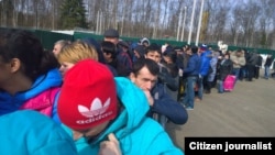 Central Asians wait in line at a migration center in Sakharovo, Moscow.