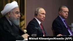 Iranian President Hassan Rohani (left) Russian President Vladimir Putin (center), and Turkish President Recep Tayyip Erdogan address the media after a trilateral meeting on Syria in Sochi, November 22, 2017