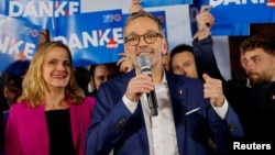 Freedom Party leader Herbert Kickl talks to supporters in Vienna late on September 29, as vote projections showed his party winning Austria's general election.