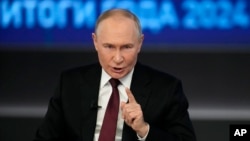 Russian President Vladimir Putin gesticulates during a Q&A session in Moscow on December 19. 