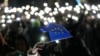 A demonstrator holds the EU flag during a rally outside the parliament building in Tbilisi on December 4.