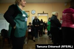 An observer monitoring the voting in Temka