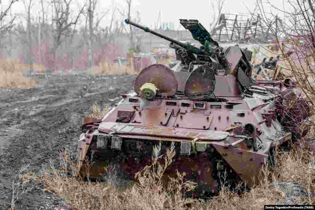 A destroyed armored vehicle on a road in what remains of Maryinka, seen on December 4. Grom says the city was unusually green and &quot;was beautiful in the spring when the fruit trees blossomed.&quot;&nbsp;