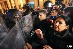 President Salome Zurabishvili (right) attends an anti-government demonstration in downtown Tbilisi on November 28.