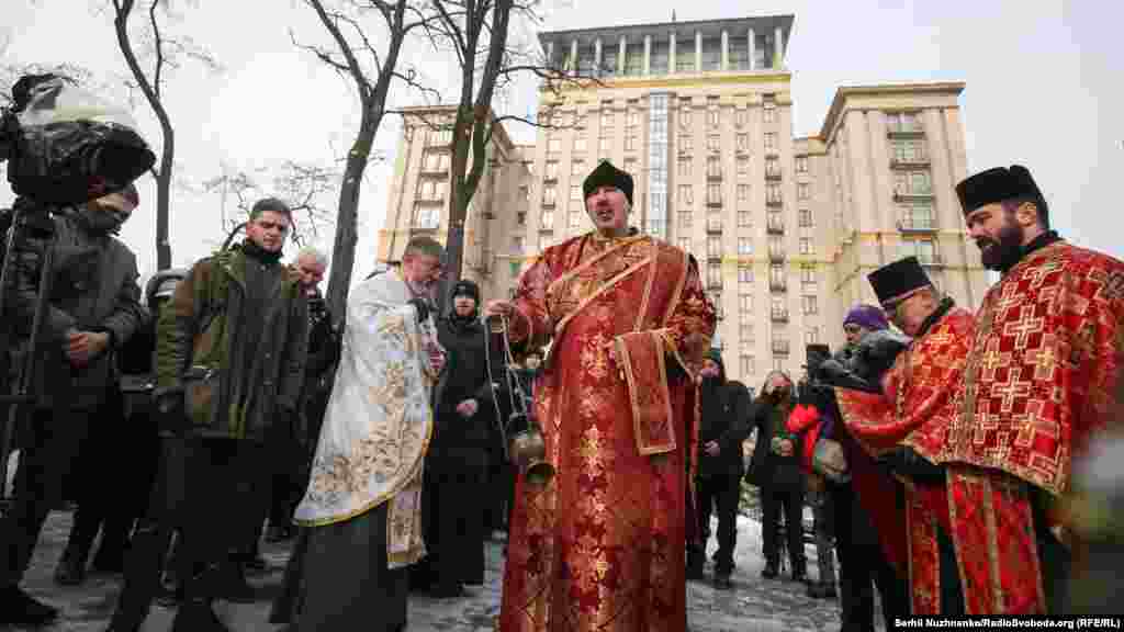 A priest says a&nbsp;​prayer in memory of those killed seven years ago. Most of the victims lost their lives between February 18-20, with 49 people dying on February 20.