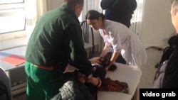 Emergency medical workers help a sick student in Beryozovka in January 2015 during another incident suspected to be linked to the nearby Karachaganak field.