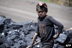 An Afghan boy works at a coal mine in Samangan Province.