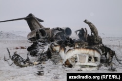 The wreck of a U.S. Bombardier E-11A is seen in Afghanistan's Ghazni Province on January 27. The U.S. Air Force jet crashed on a remote plain south of Kabul, killing at least two crew members. (Habib Taseer, RFE/RL)