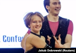 Katerina Tikhonova (left) dances during the World Cup Rock'n'Roll Acrobatic Competition in Krakow, Poland, in 2014.