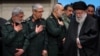 Supreme Leader Ayatollah Ali Khamenei (right) and the IRGC want to strike Israel, but internal debates about the associated risks have contributed to delaying the attack. (file photo)