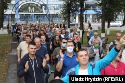 Workers from the BelAZ automobile plant march in Zhodzina on August 26. One of the most notable aspects of the postelection protests against Lukashenka is that many factory workers, long considered the bedrock of his base, have also participated