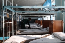 Prisoners often sleep in open barracks and eat together in large dining halls. (file photo).