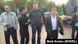 Pro-Kremlin activists from the SERB movement, including Igor Beketov (second from right) and Aleksandr Petrunko (right)