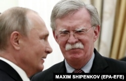 Russian President Vladimir Putin (left) meets with U.S. national-security adviser John Bolton at the Kremlin on October 23.