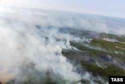 A 2011 file photo of fires smoldering across the wilderness of the Sakha region.