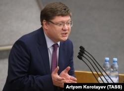 Several Russian opposition politicians have lobbied Washington to hit President Vladimir Putin's government with sanctions. State Duma deputy Andrei Isayev (above) says new draft legislation could make such activism a crime.