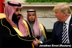 U.S. President Donald Trump (right) meets with Crown Prince bin Salman at the Oval Office in 2018.