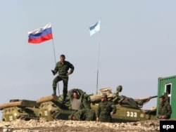 Russian soldiers prepare to leave a checkpoint near the Georgian village of Nadarbazevi in October 2008.