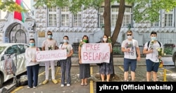 Serbian youth activists lay flowers in front of the entrance to the Belarusian Embassy in Belgrade on August 14 as an expression of support for the citizens of Belarus.