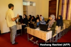 Female students attend a class to learn coding in the western Afghan city of Herat before the Taliban takeover. (file photo)