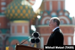 Russian President Vladimir Putin delivers a speech during the Victory Day parade on Red Square in Moscow on May 9 -- the last with Lenin present?