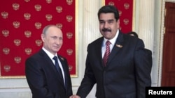 Russian President Vladimir Putin (left) shakes hands with Venezuelan President Nicolas Maduro at the Kremlin in 2015.