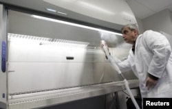 A technician demonstrates equipment during a media tour of a biological research facility built by the U.S. Defense Threat Agency in Tbilisi in 2011. (file photo)