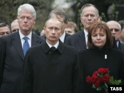 Clinton and former U.S. President George H.W. Bush attend Yeltsin's funeral with Putin and his wife, Lyudmila, in Moscow on April 25, 2007.