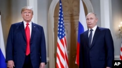 U.S. President Donald Trump (left) and Russian President Vladimir Putin, stand together before a meeting in Helsinki in 2018.