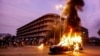 Smoke plumes from a police vehicle set on fire by supporters of Pakistan's blasphemy laws in the southern sea port city of Karachi in October 2024. (file photo)