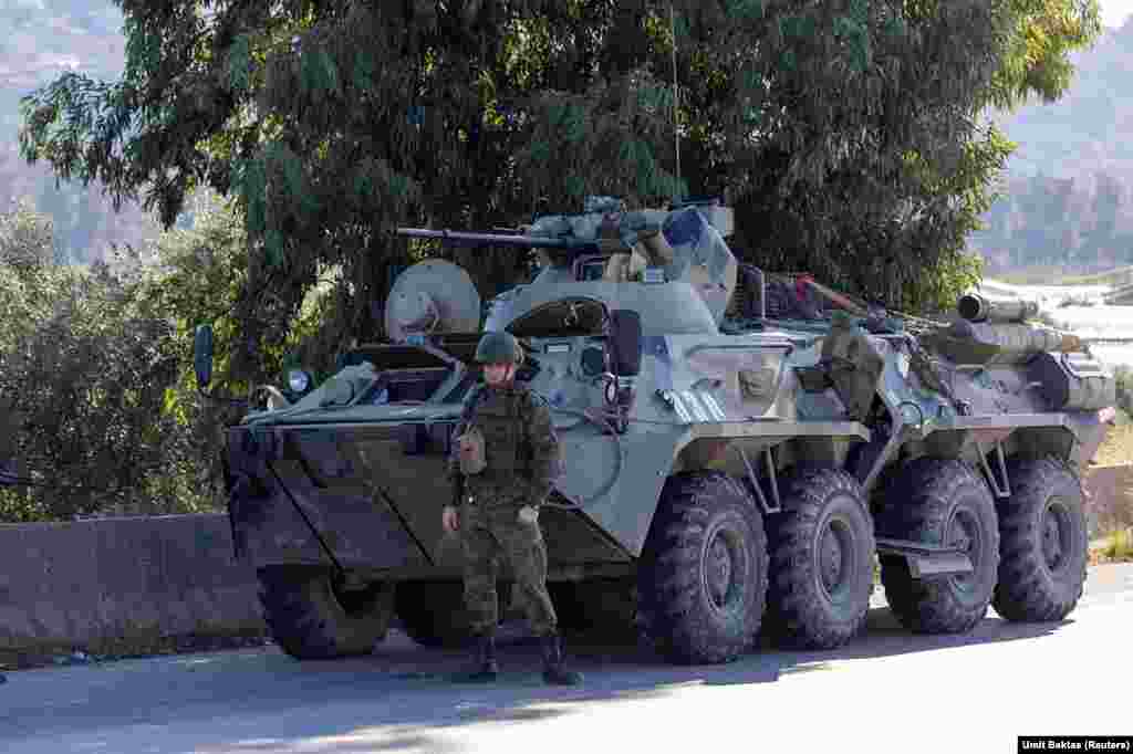 A Russian soldier guards a vehicle near the Hmeimim air base.&nbsp; In a written statement describing his escape from Syria, ousted leader Bashar Al-Assad says he was initially flown from Damascus to the Hmeimim base amid the massive rebel advance . From there he was eventually airlifted to Russia on December 8 after the Russian facility &quot;came under intensified attack by drone strikes.&quot;&nbsp;