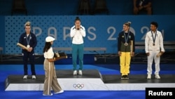 Uzbek judoka Diyora Keldiyorova (center) won gold in the women's 52-kilogram competition at the Paris Olympics.